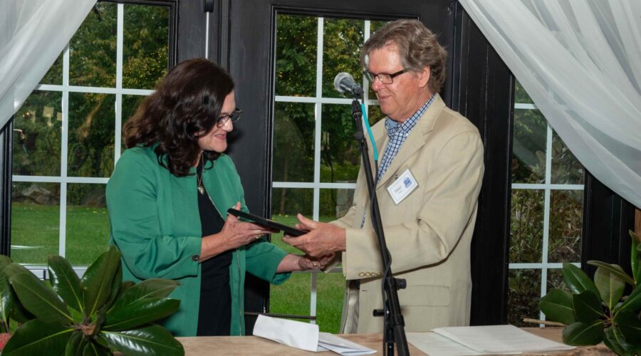 Peter Weeks presents Supervisor Laura TeKrony with the 2026 Friend of the Mountain Award